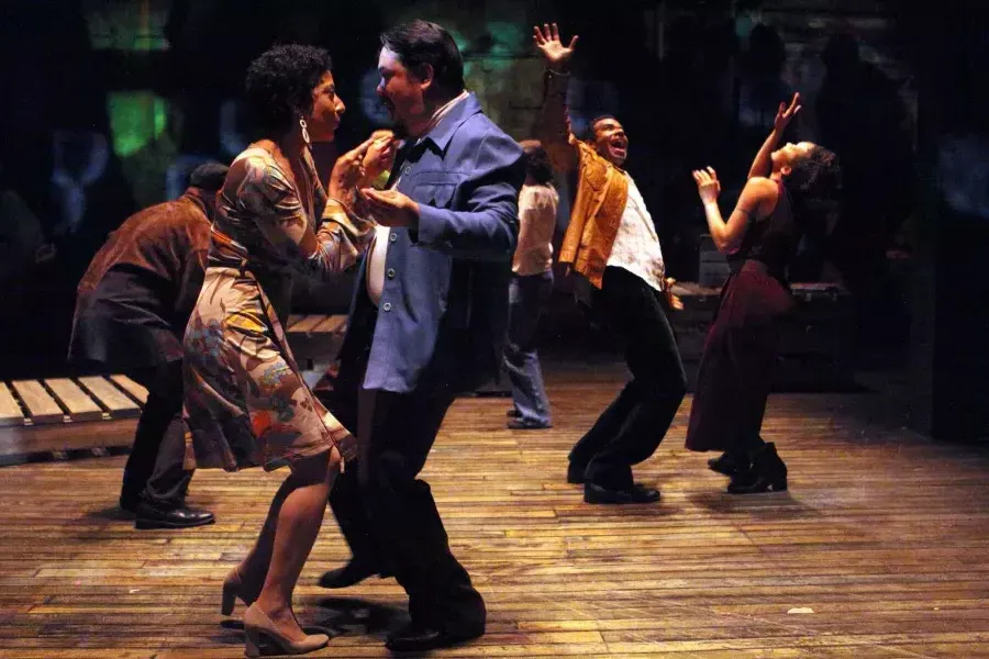 Performers in mid-20th century costume dance on stage at the Magic Theatre during a performance of "Gangster of Love."